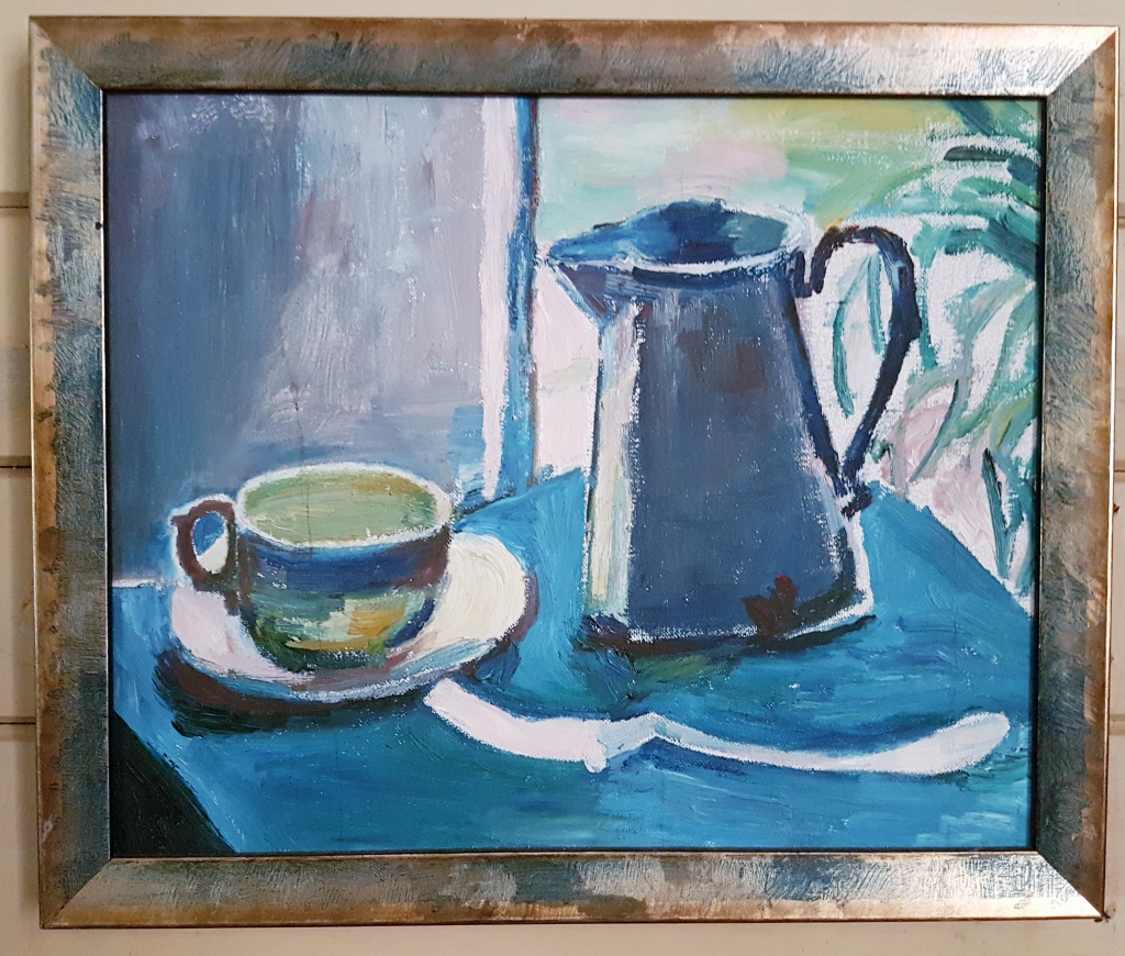 Unsigned still life acrylic painting in blues and greens depicting a teacup and possibly an enamel water jug on a table topped by a blue cloth.  A green pot-plant is in the background at the right of image.