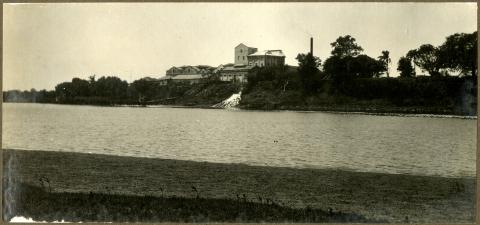 View of Bundaberg Rum Distillery and Burnett River, c1931