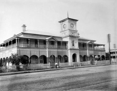 Exterior of the post office in Mackey, showing Queenslander style architecture and clock tower