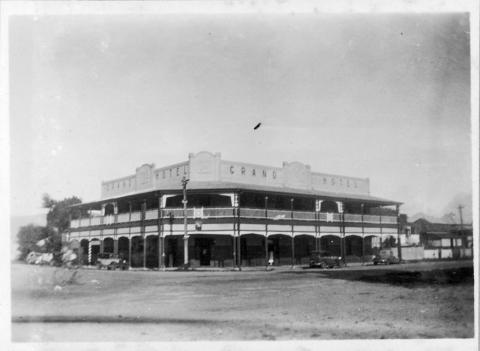 Exterior view of the Grand Hotel in Cairns from the across the street showing the facade and verandahs