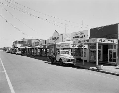Main Street of Cloncurry showing a truck parked in front of a row of shops