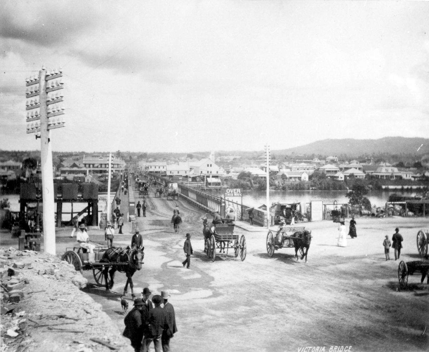 View of Victoria Bridge with horses and carriages crossing