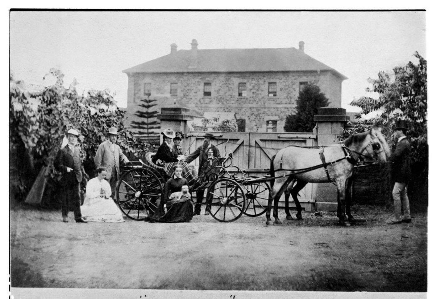 Archer family with horse-drawn carriage in front of Brisbane military barracks.