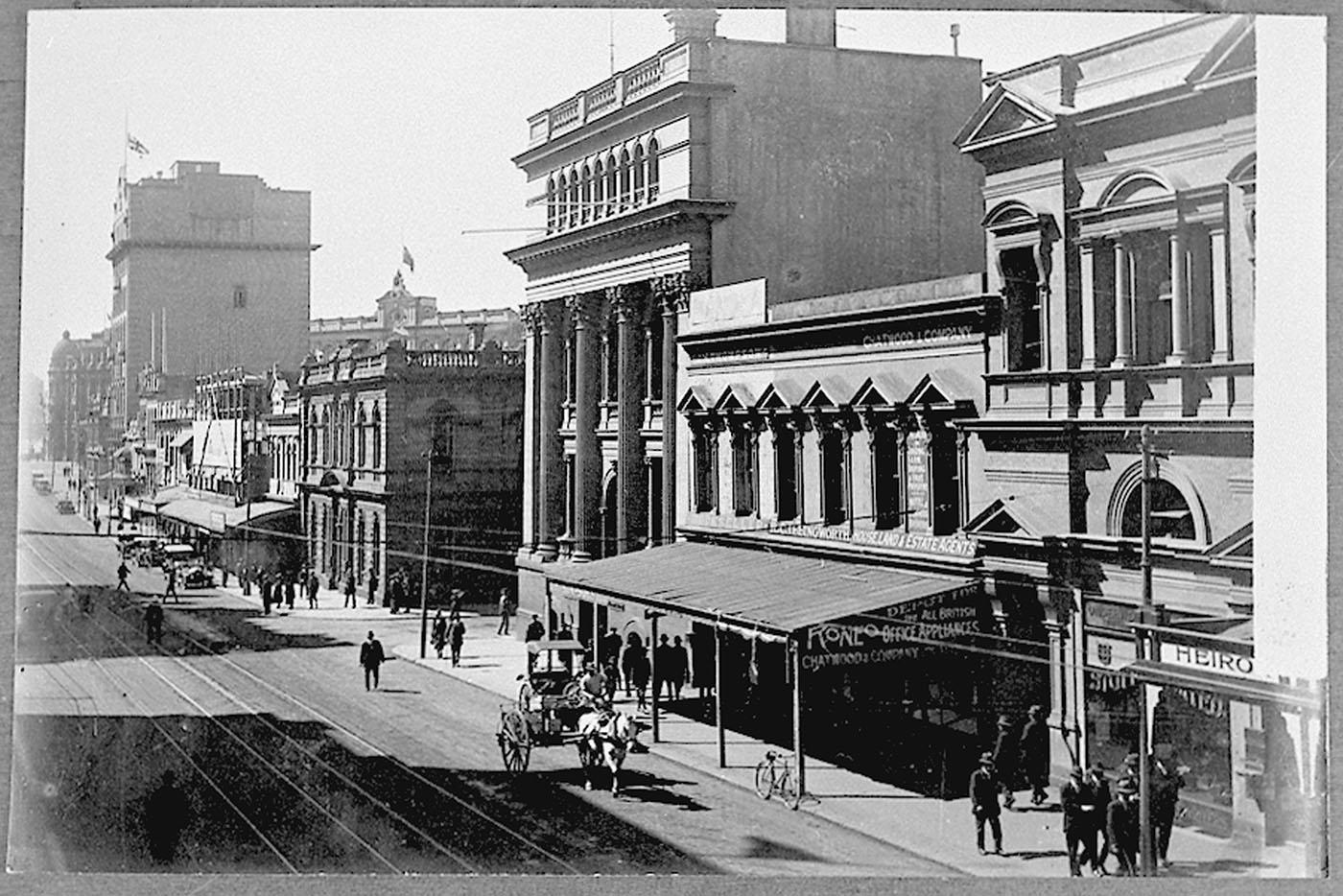 View of Queen Street in the 1920s Brisbane showing building facades