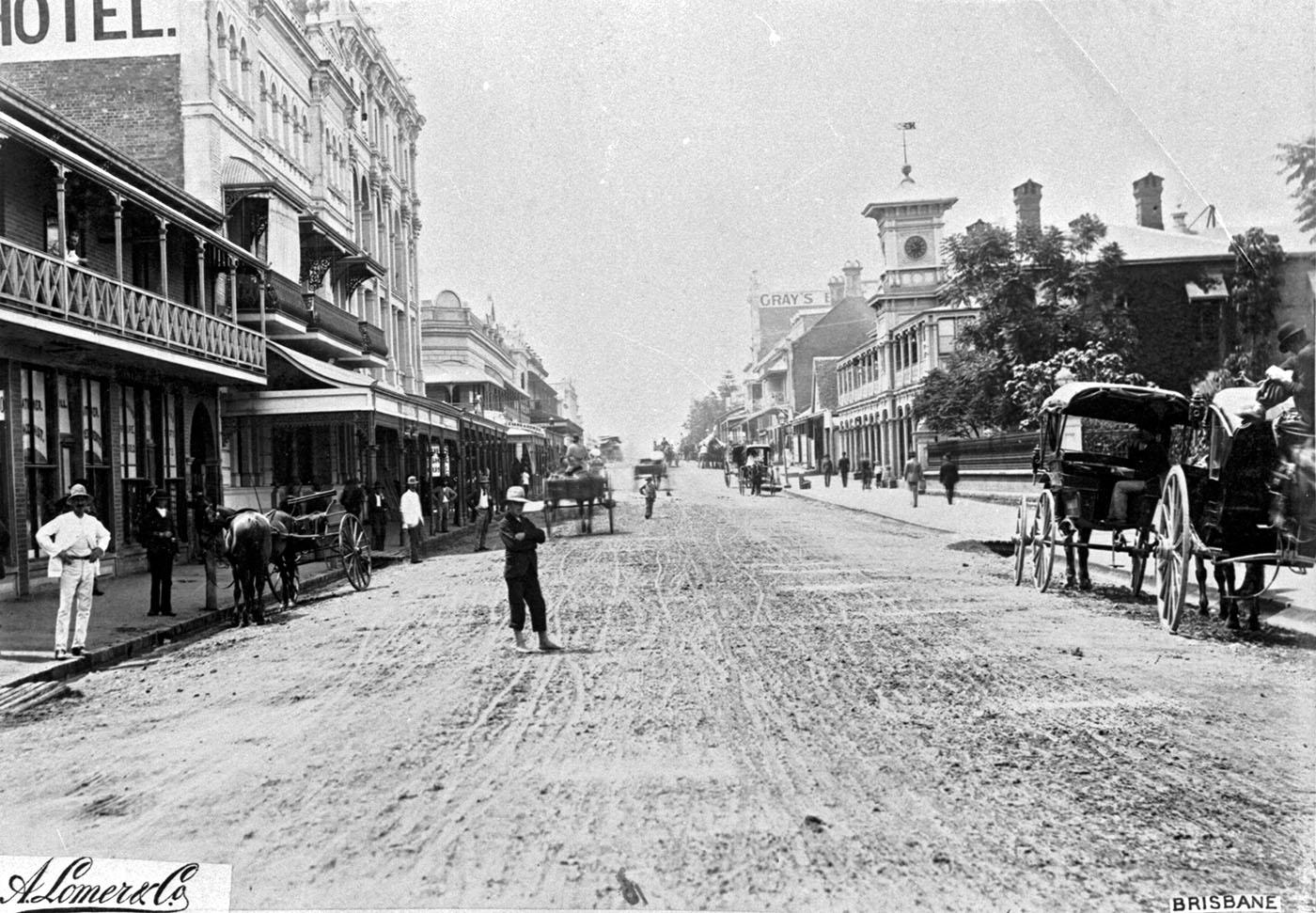 George Street with horse-drawn carriages and pedestrians.