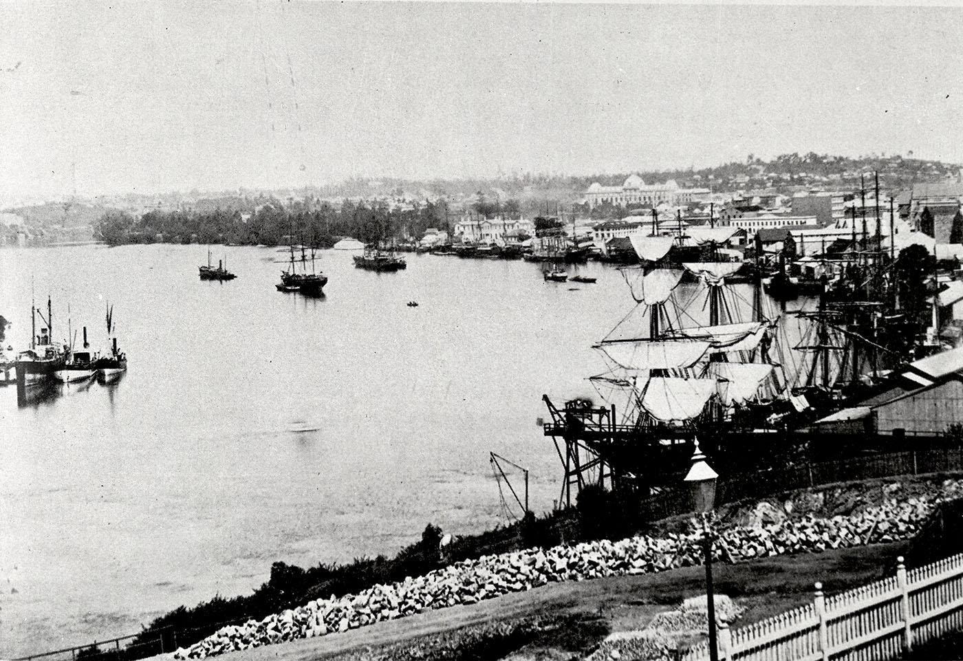 View of Brisbane River in the 19th century with large sailboats moored