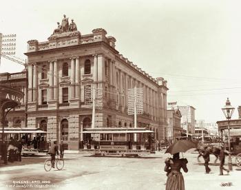 AMP Building in late 19th century with people walking in front in period dress