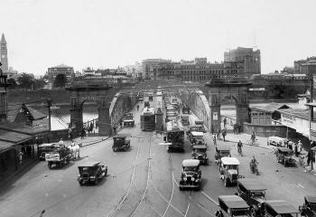 View of busy traffic passing over Victoria Bridge in October 1930