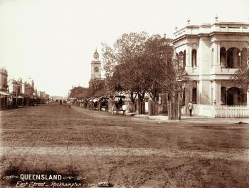 View of East Street, Rockhampton featuring the Post Office and horses