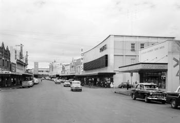 View of Russell Street, Toowoomba in 1961 including buildings and vehicles.