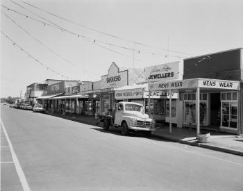 Main Street of Cloncurry showing a truck parked in front of a row of shops